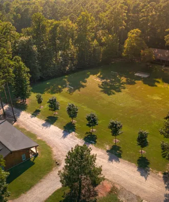 Aerial photo of Camp Kanata campus showing cabin and fields