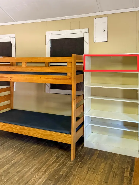 An image of the bunkbeds and storage in Cabin 13.